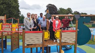 Photo of the new Wisbech Park Play Area opening. In the image, from L to R; Cllr Peter Human, Mayor of Wisbech,	Cllr Lucie Foice-Beard, Cllr Steve Tierney, Cllr Sidney Imafidon, Cllr Peter Murphy, Cllr Sam Hoy, Mrs Janey Tanfield, Simon Carson